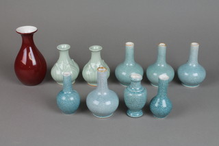 7 contemporary crackle glaze turquoise bottle vases, a pair of modern celadon vases and a modern sang de boeuf vase 