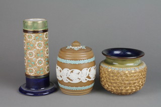 A Doulton Silicon barrel tobacco jar and cover with blue and white floral decoration 5 1/2", a Royal Doulton squat oviform vase with gilt floral decoration 4" and a ditto cylindrical vase with spread foot 7 1/2 