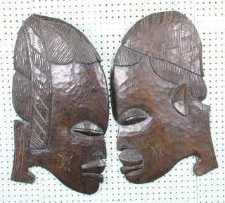 A pair of carved African hardwood wall masks 21" 