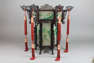 A Chinese pierced hardwood lantern with glass panels 15"