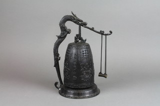 A Japanese bronze temple bell supported by a figure of a dragon 12" 