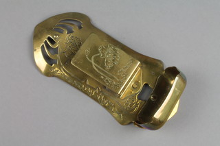 An Art Nouveau engraved and pierced brass wall mounting match box holder, the reverse marked Ges. Geshc 7" 