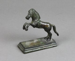 A bronze figure of a rearing horse raised on a rectangular base 3" 