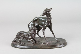 After Mene, a bronze figure of 2 standing dogs raised on an oval base 5"