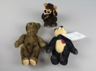 A Deb Canham Art Design figure Panda 6", a Schuko Ware bear 4" and a brown bear with articulated limbs 7" 