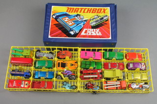 A collection of Matchbox toy cars contained in a plastic carrying case 