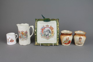 A collection of commemorative ware including a Coronation wall plaque, a pair of baluster vases, a jug and cup