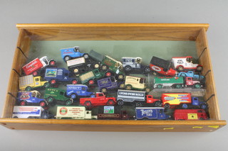 3 oak finished display cabinets containing a collection of toys cars