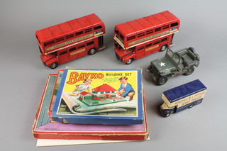2 large pressed metal models of London buses, a Corgi Bedford Luton removals van, a pressed metal model of a Willys Jeep, a green and brown Bayko building, a Tiny Town School set and a Noddy jigsaw puzzle 