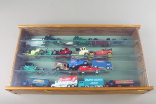 5 oak finished display cabinets containing a collection of toy cars 