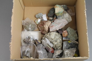 A cardboard box of various mixed minerals