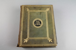 A leather album containing various postcards of Colonial scenes and WWI