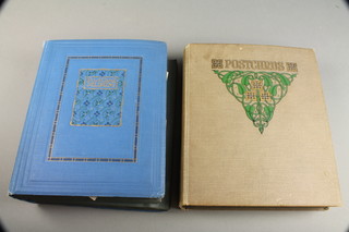 A blue postcard album containing various postcards including WWI, buildings and architecture together with a green ditto 
