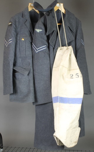 A 1948 Royal Air Force Corporals tunic and trousers complete with berry, Great Coat and kit bag  