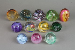 12 Caithness paperweights including fluted and faceted