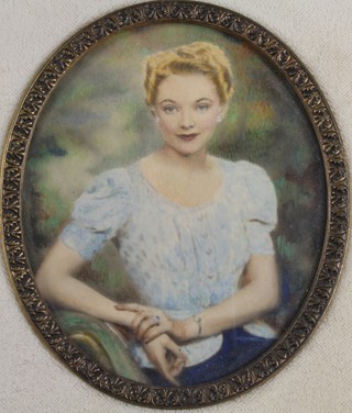 A 1920's watercolour, portrait miniature of a seated lady in a velvet frame 3" x 2" 
