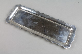 A silver rectangular pin tray with cut border, London 1979, 100 grams