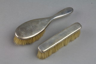 A silver backed baby's hair brush and clothes brush London 1912