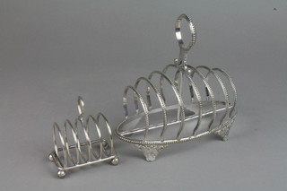 An Edwardian 7 bar plated toast rack with beaded decoration and scroll feet, a 5 bar ditto