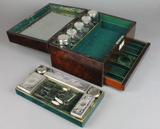 A Victorian rosewood toilet box containing silver plated mounted glass jars