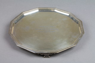 A silver salver with stylised scroll legs, Sheffield 1936, 248 grams, 9" 