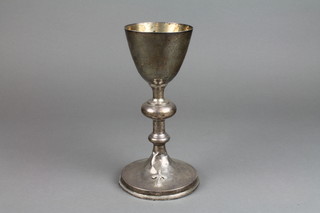 A 19th Century Continental silver chalice with knopped finial and splayed base with beaded decoration and applied cross, the base being lead weighted 9"