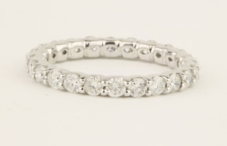 A white gold diamond full eternity ring set 24 brilliant stones, approx 1.2ct, size K 1/2