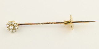 A 15ct gold seed pearl tie pin in a Cartier box 
