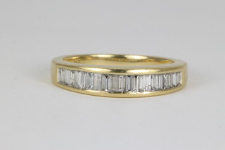 An 18ct yellow gold channel set, baguette cut, 20 stone diamond ring, approx 1/2ct  size N