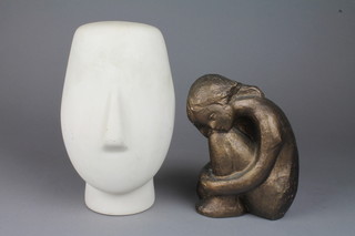 A 1970's stylish white glazed mask vase 9", a ditto of a crouching figure 5" 