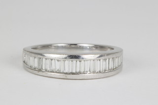 An 18ct white gold baguette set diamond ring, approx 1ct size O