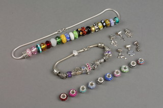 A contemporary silver and glass bead necklace, a charm bracelet and a quantity of charms