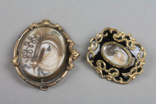 A Victorian gilt metal and enamelled memorial brooch, ditto swivel brooch 