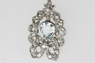 A white gold, aquamarine and diamond open pendant, the centre stone approx 1.5ct, on an 18ct white gold chain  