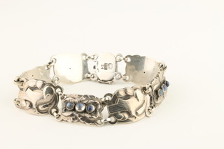 Georg Jensen, a sterling silver 7 plaque bracelet decorated with stylised doves and cabouchon cut moonstones no.24