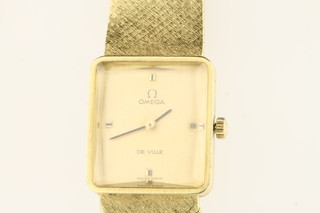 A lady's 18ct gold Omega Deville wristwatch with mechanical movement and mesh strap, approx. 57 grams