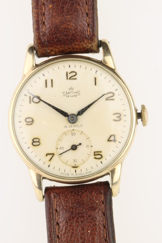 A gentleman's 9ct gold Smiths Deluxe wristwatch with engraved inscription, 6 grams