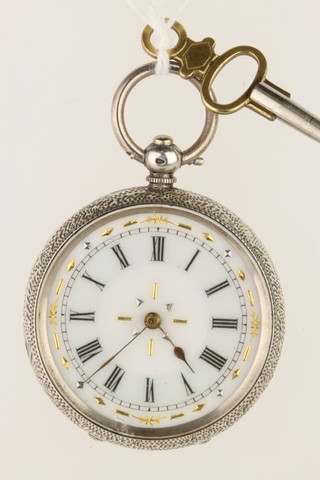 A lady's Edwardian silver fob watch with enamelled dial and key
