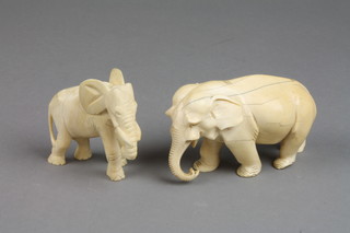 An Antique carved ivory figure of a standing elephant 4" and a bone ditto 