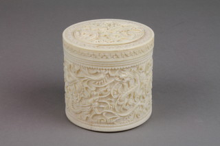 A carved Cantonese ivory cylindrical box decorated with dragons and scrolls 3 1/2" 