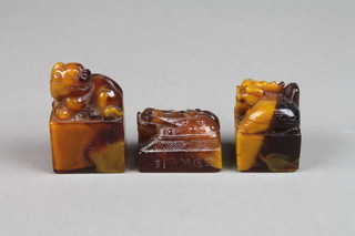 3 carved amber seals with shi shi tops 2", 1 1/2" and 1 1/4" 