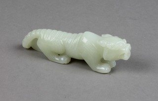 A carved jade figure of a standing lion 4" 