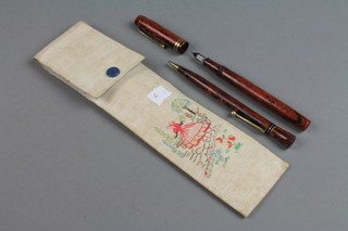 A 1920's orange marbled Conway fountain pen no.477, a ditto propelling pencil no.3