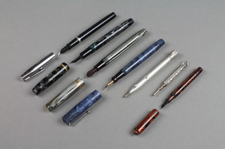 A Swan blue marble fountain pen, a Burnham B48 black marbled fountain pen, a grey Waterman W5 ditto, 1 other and 3 pencils