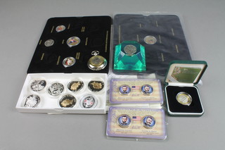 A collection of modern commemorative coins and crowns