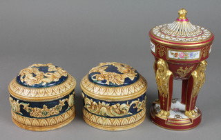 An early 20th Century Sevres pot pouri, the burgundy ground with gilt decoration and panels of spring flowers supported by 4 monopedia 9", 2 lidded boxes 