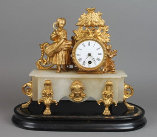 A 19th Century French timepiece contained in a gilt painted spelter case with a figure of lady representing The Harvest, raised on an alabaster base 