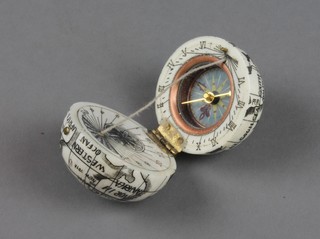 A reproduction carved bone pocket sundial in the form of a Globe 1" 