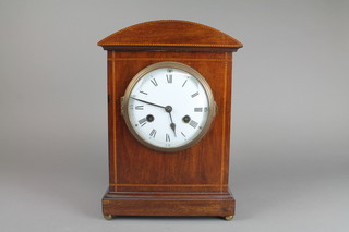 An Edwardian mahogany and barber pole inlaid striking mantel clock, having an enamelled dial with Roman Numerals, 13.5"h x 9.5"w x 5.5"d