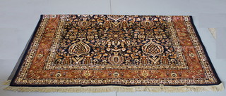 A blue ground Belgian cotton Tabriz style carpet 107" x 80"